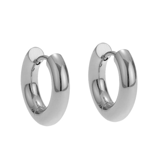 Two silver hoop earrings earrings on a white background.