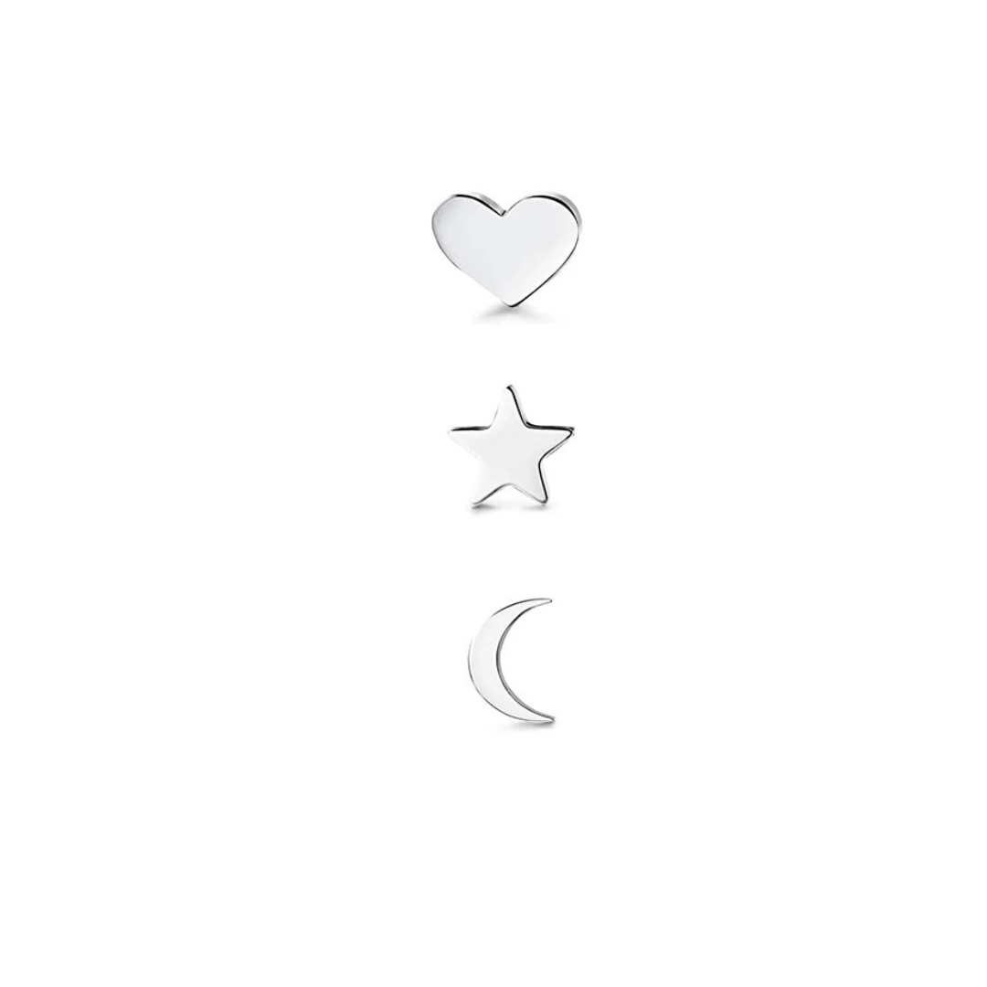 Three silver charms in the shapes of a heart, a star, and a crescent moon from The Trio Set: Heart, Moon and Star Silver, stacked vertically on a white background.