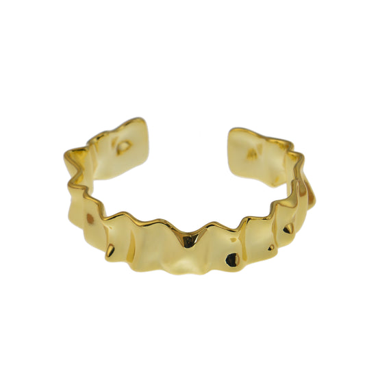 Gold-colored bracelets cuff bracelet with a textured, undulating design.