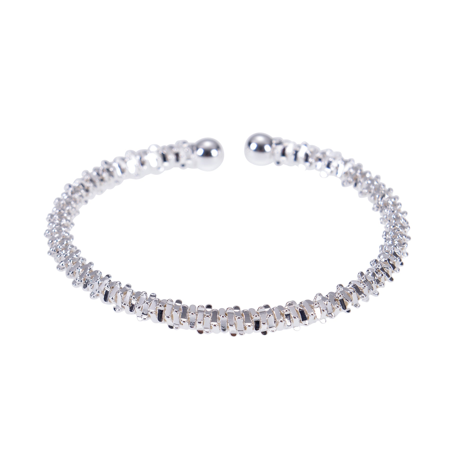 Silver open bangle bracelets on white.