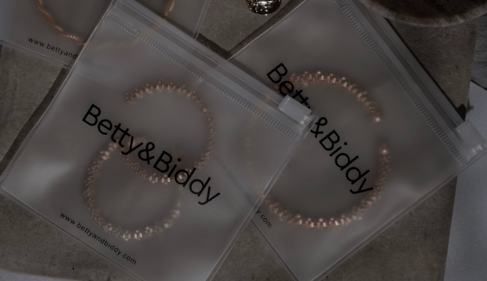 Earrings in Betty & Biddy packaging.