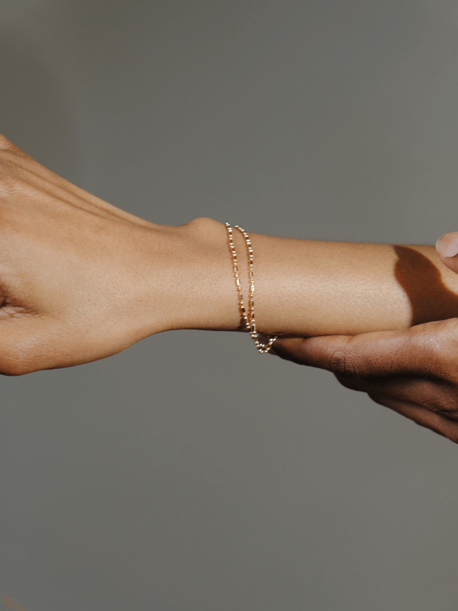 Close-up of a Double Layer Link Bracelet on a person's wrist.