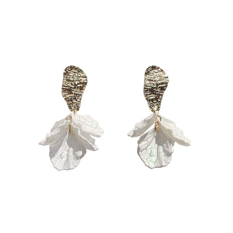 Two earrings with textured gold-colored tops and white petal-like bottoms. earrings