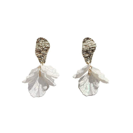 Two earrings with textured gold-colored tops and white petal-like bottoms. earrings