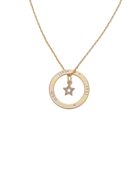 A delicate necklace featuring a gold chain, circular pendant with engraved lettering, and a star-shaped charm.