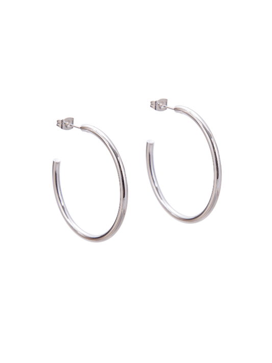 A pair of silver hoop earrings.