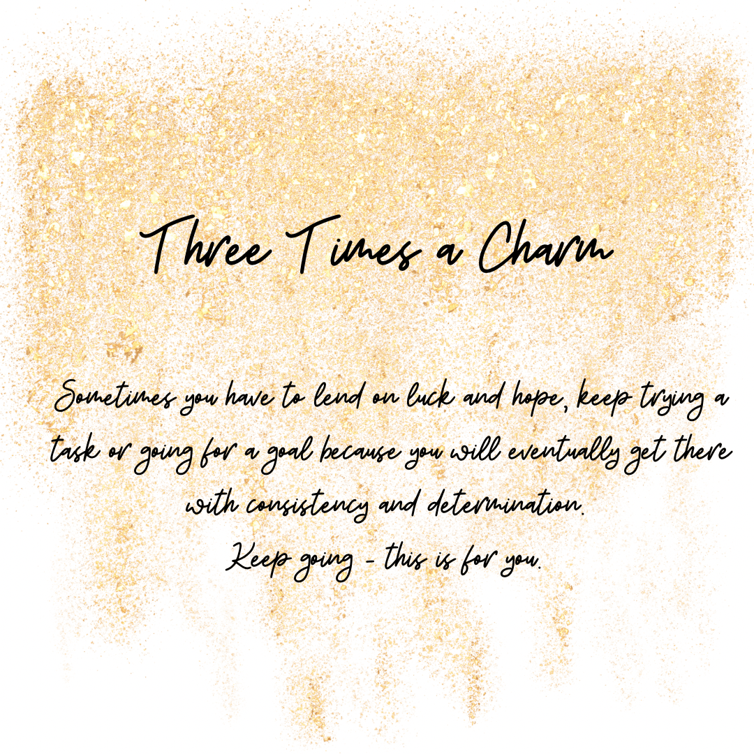 Three Times A Charm Star Necklace inspirational quote "Three Times a Charm" with motivational text on a white background with a textured gold border.