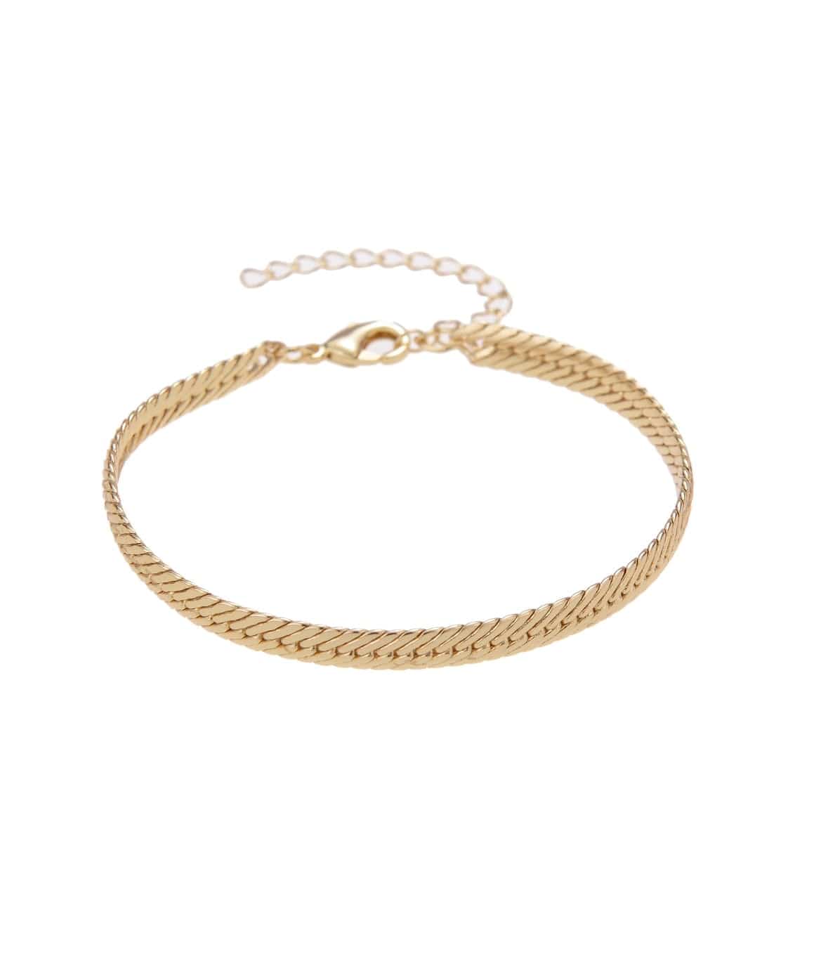 Gold herringbone chain bracelet with extender chain on white background.
