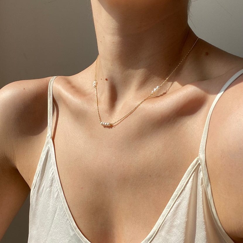 Woman wearing a Bridal Multi Line Pearl Necklace.