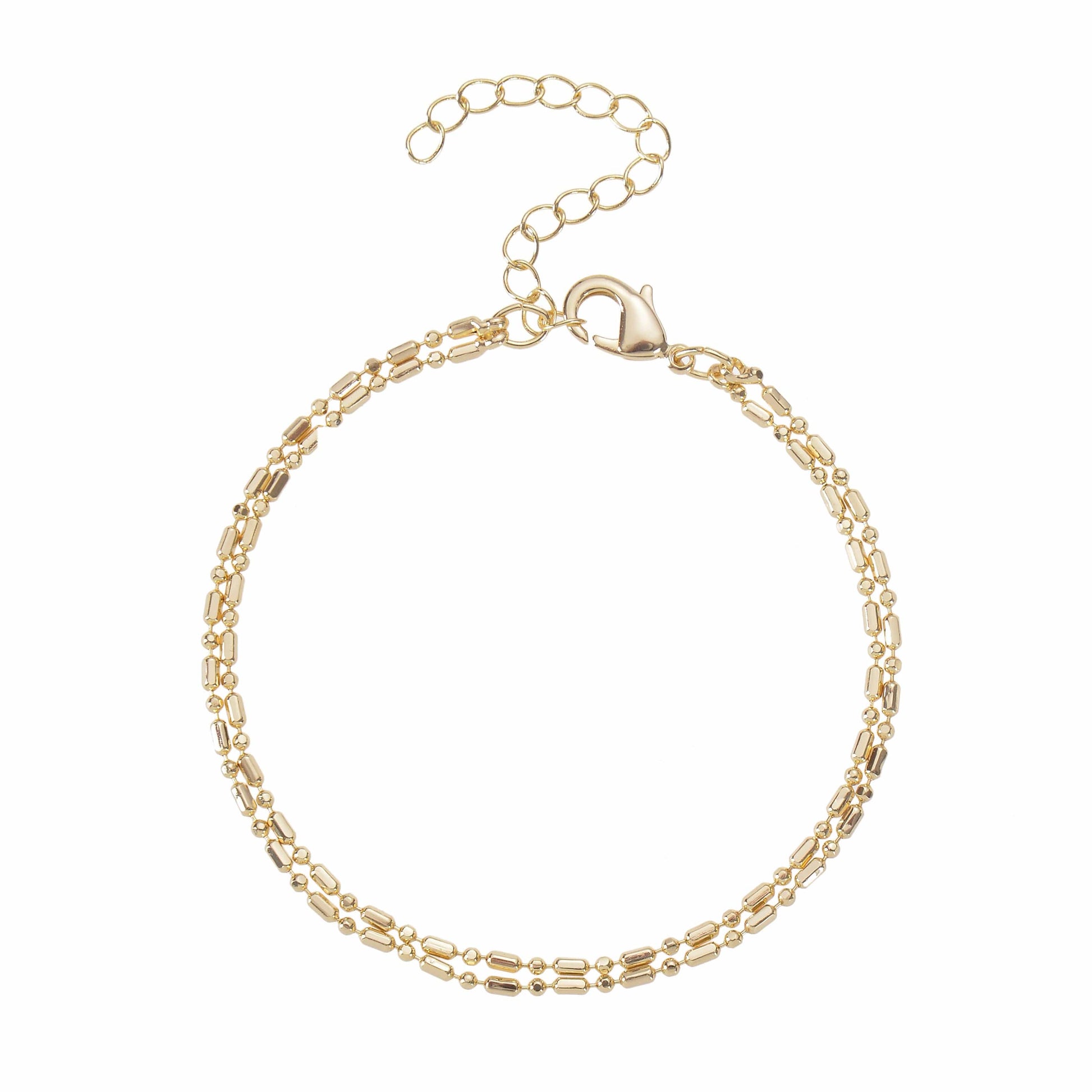 A gold-colored double-strand bracelets with an adjustable chain lies on a white background.