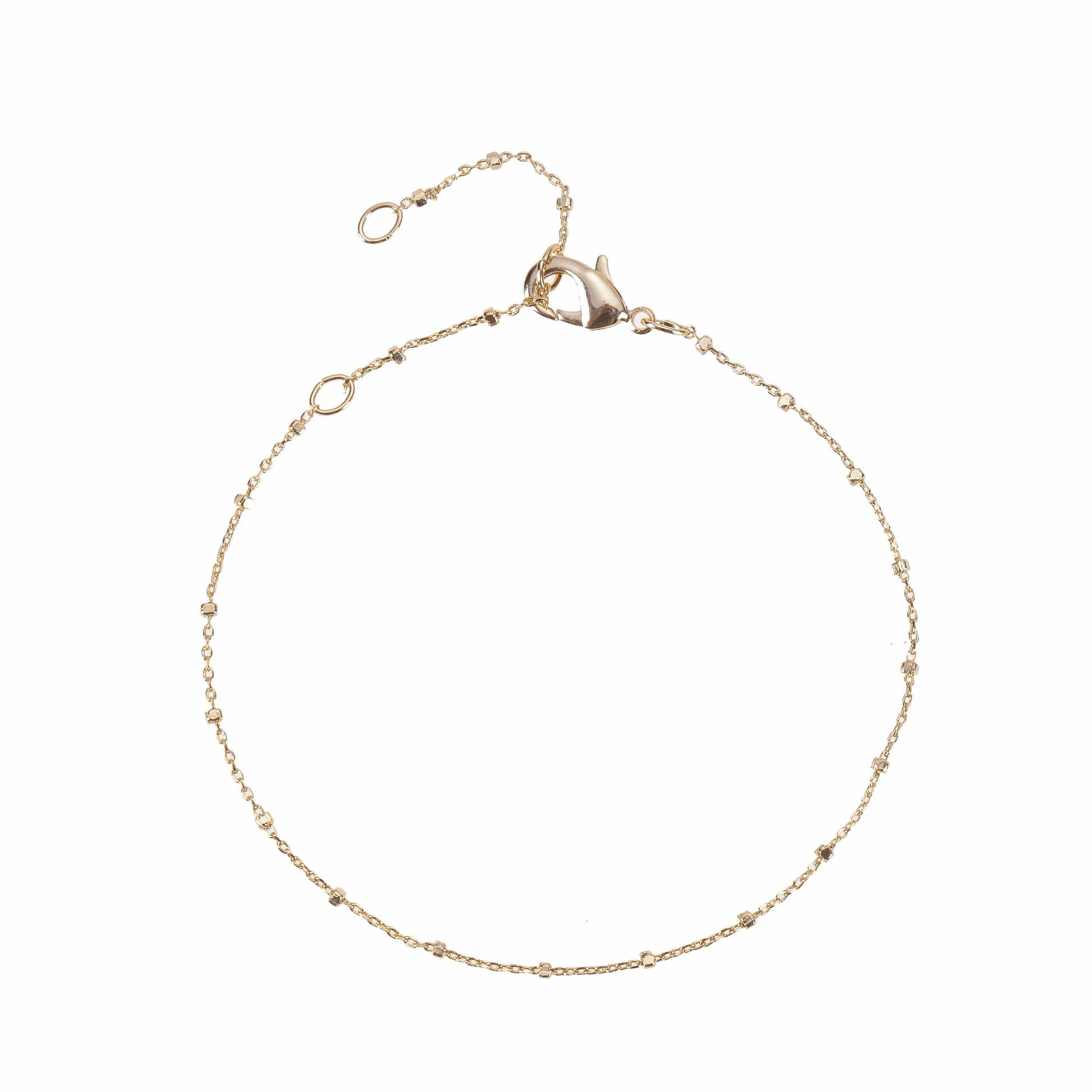 A gold bracelets chain bracelet with small bead accents.