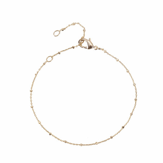 A gold bracelets chain bracelet with small bead accents.