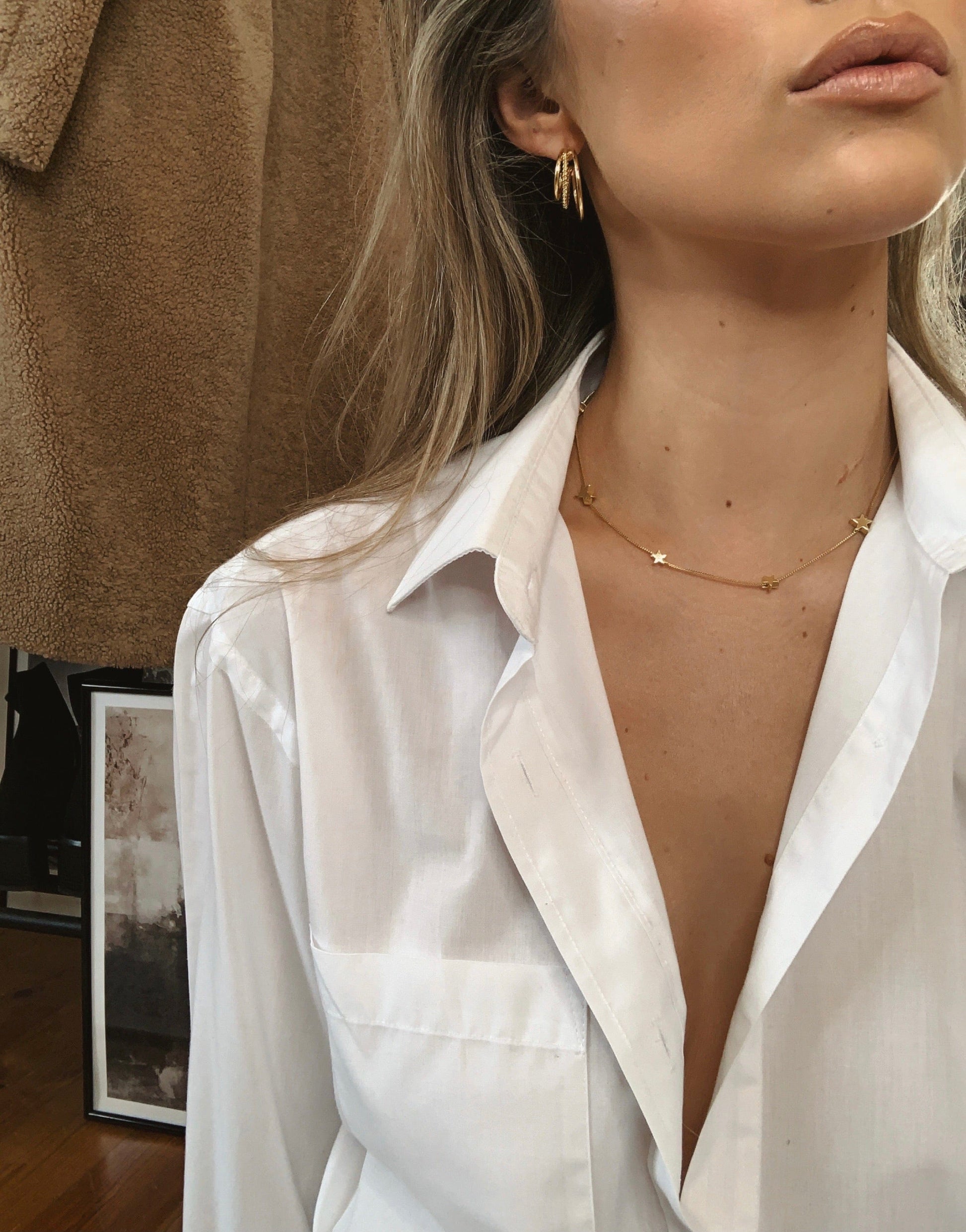 Delicate plain simple star charms on a box chain