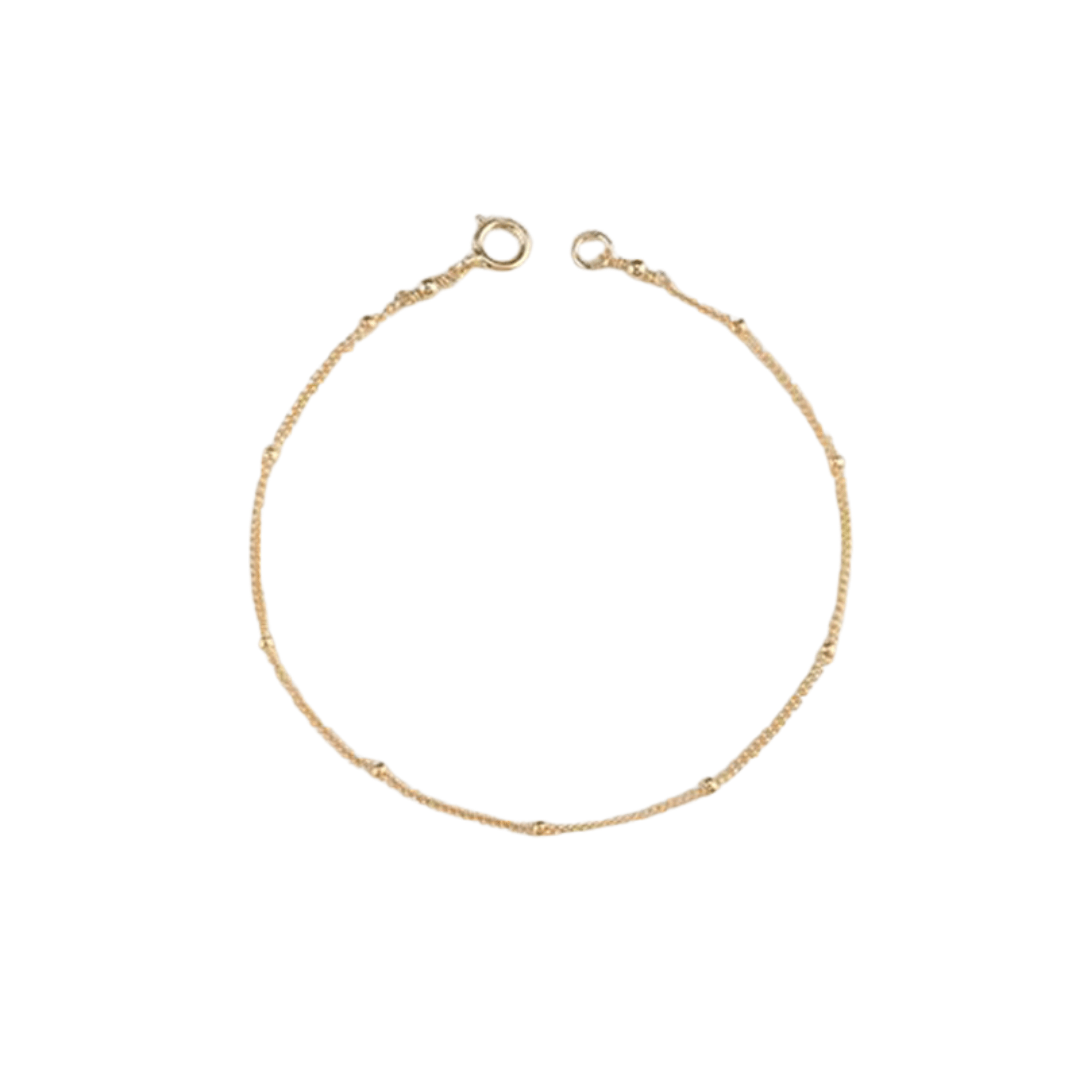 A thin gold bracelets chain with small beads and an open clasp.