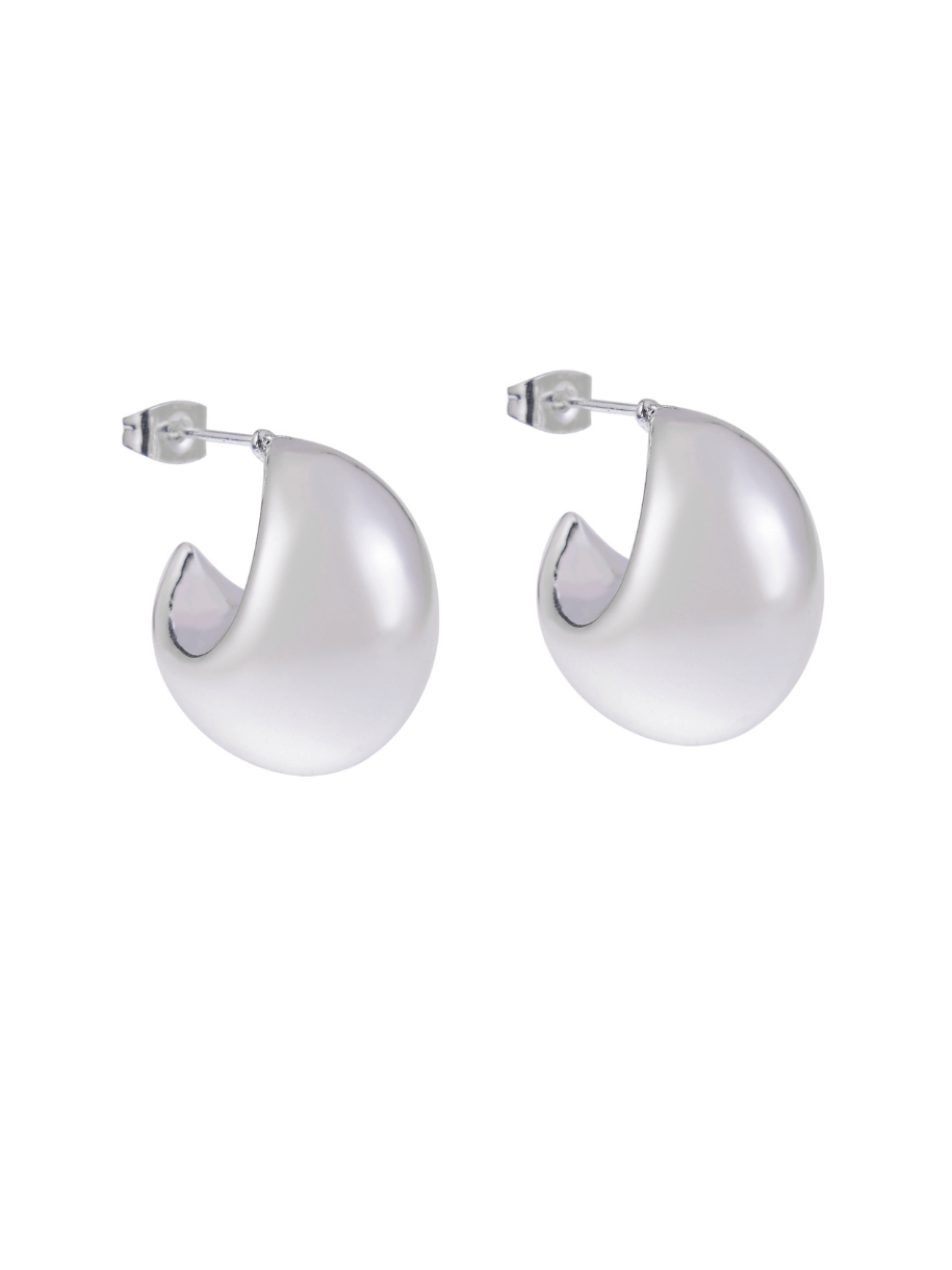 Two shiny, silver, C-shaped hoop earrings with posts on a white background.