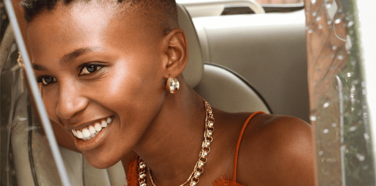 Close-up of a woman's face with a hoop earring.