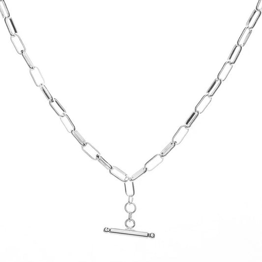 A silver delicate necklace with a T-bar clasp is shown against a white background.