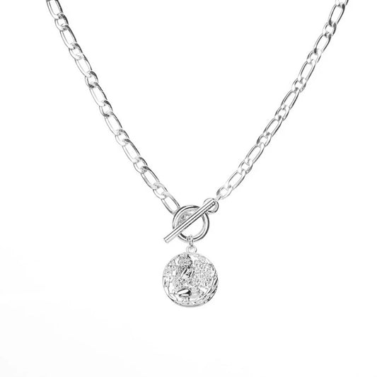 Silver delicate necklace with a round coin pendant and a toggle clasp.