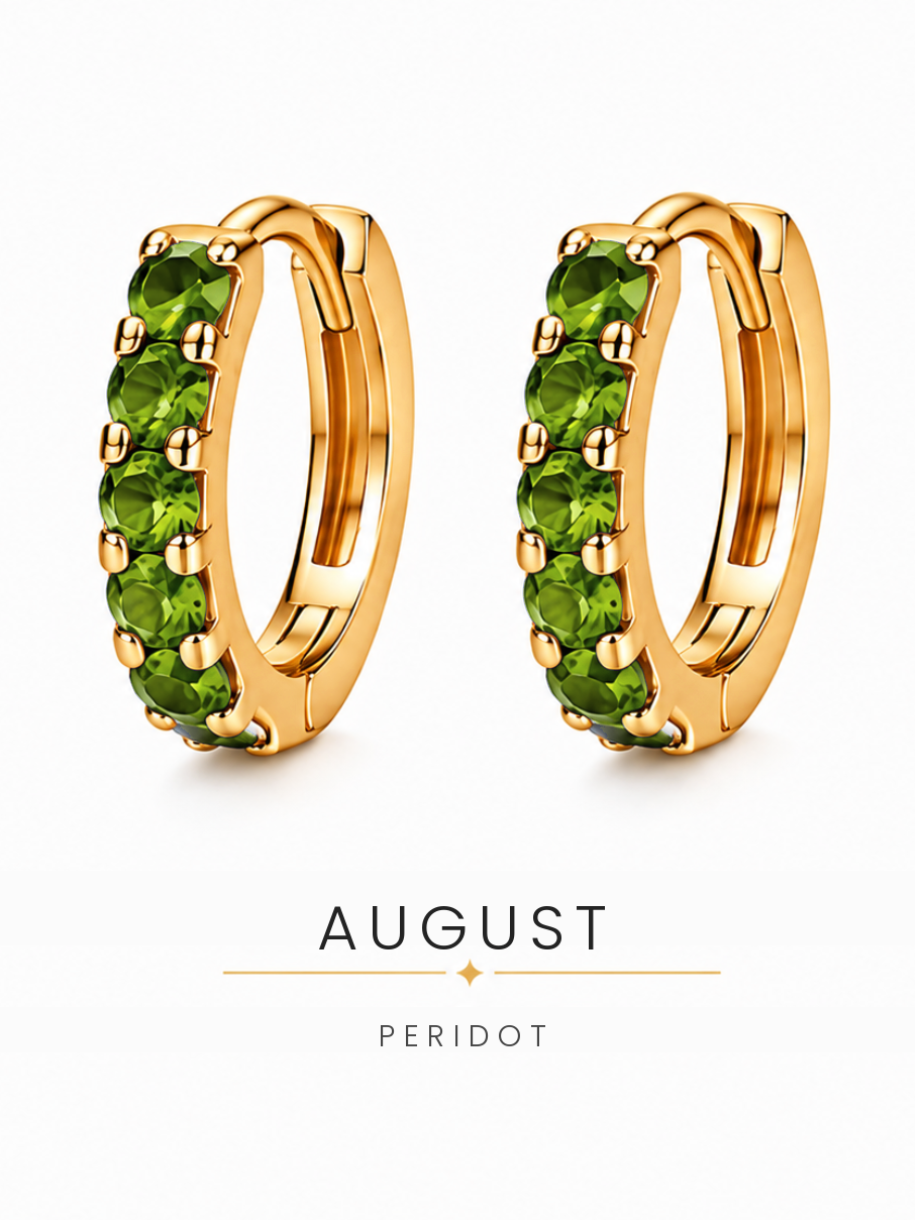 August birthstone gold huggie earrings featuring bright green peridot gemstones, birthstone jewellery