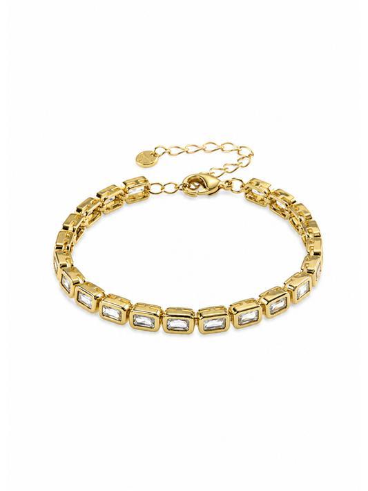 gold baguette tennis bracelet emerald cut crystals
close up gold tennis bracelet rectangular stones
sparkling baguette crystal bracelet gold