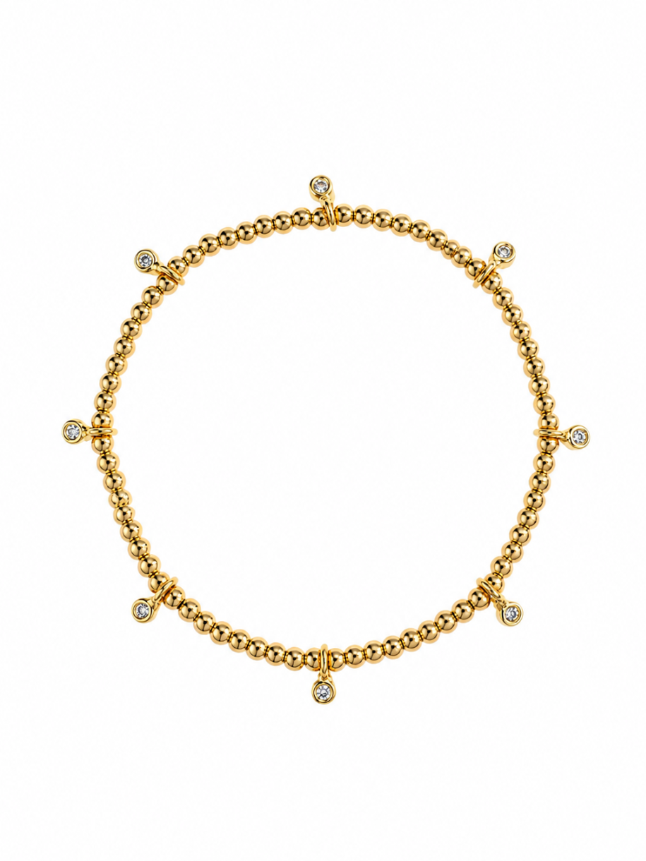 gold beaded stretch bracelet with crystal charms
close up dotted sparkle bracelet cubic zirconia