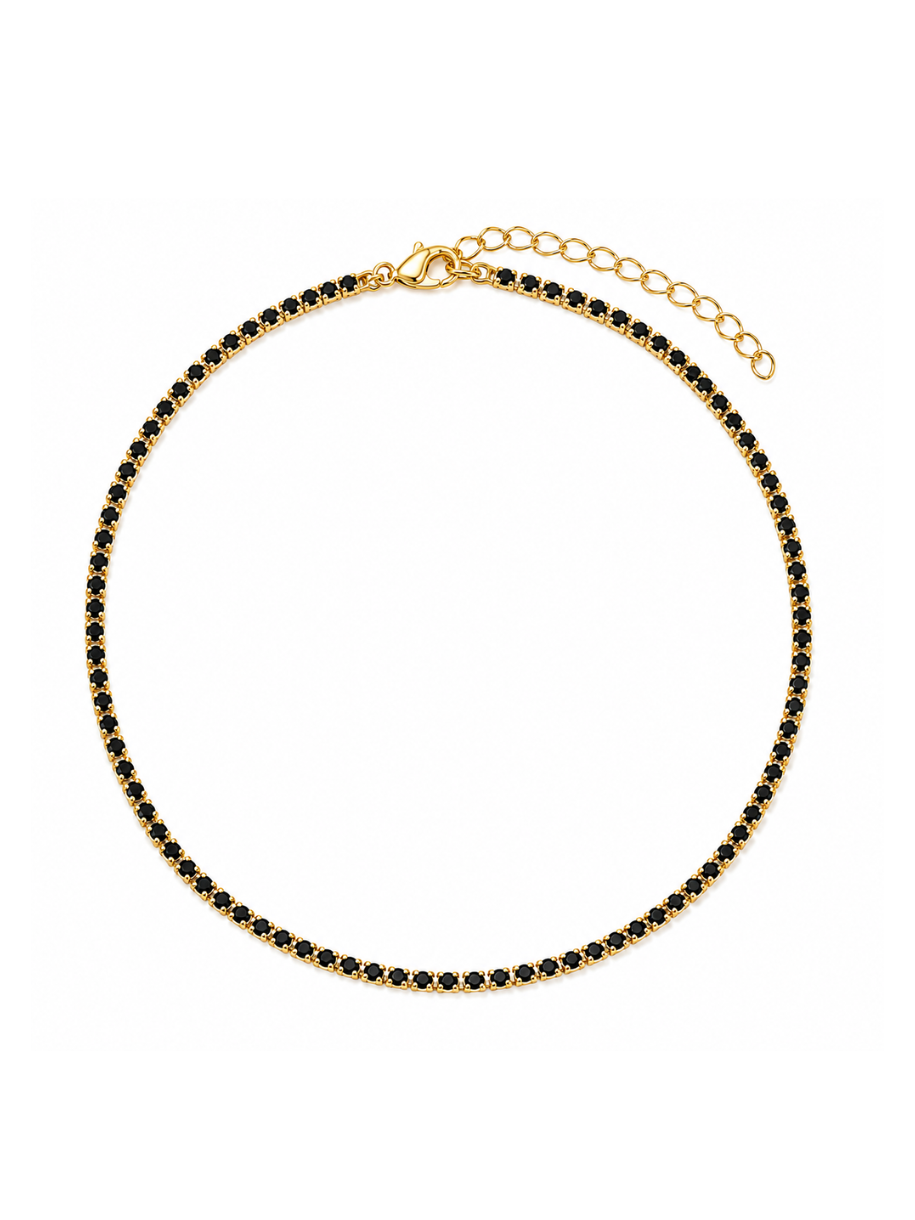 A gold chain necklace with a continuous line of small black gemstones, displayed on a clean white background.