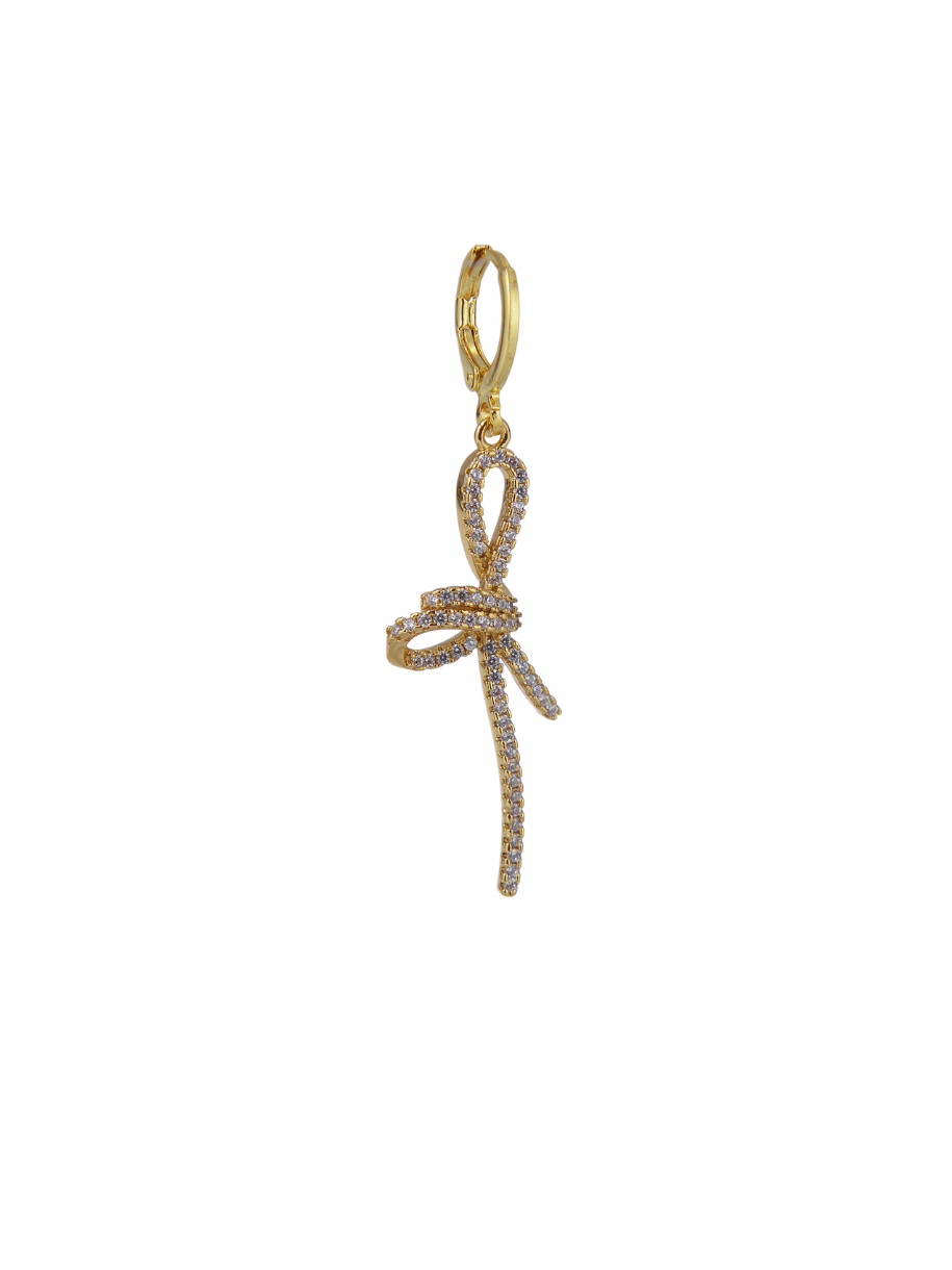A gold-colored earring with a dangling, ribbon-like design.