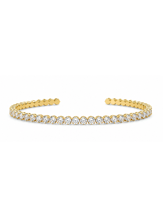 A gold open cuff bracelet featuring a continuous row of round-cut clear gemstones across the front, displayed on a clean white background.