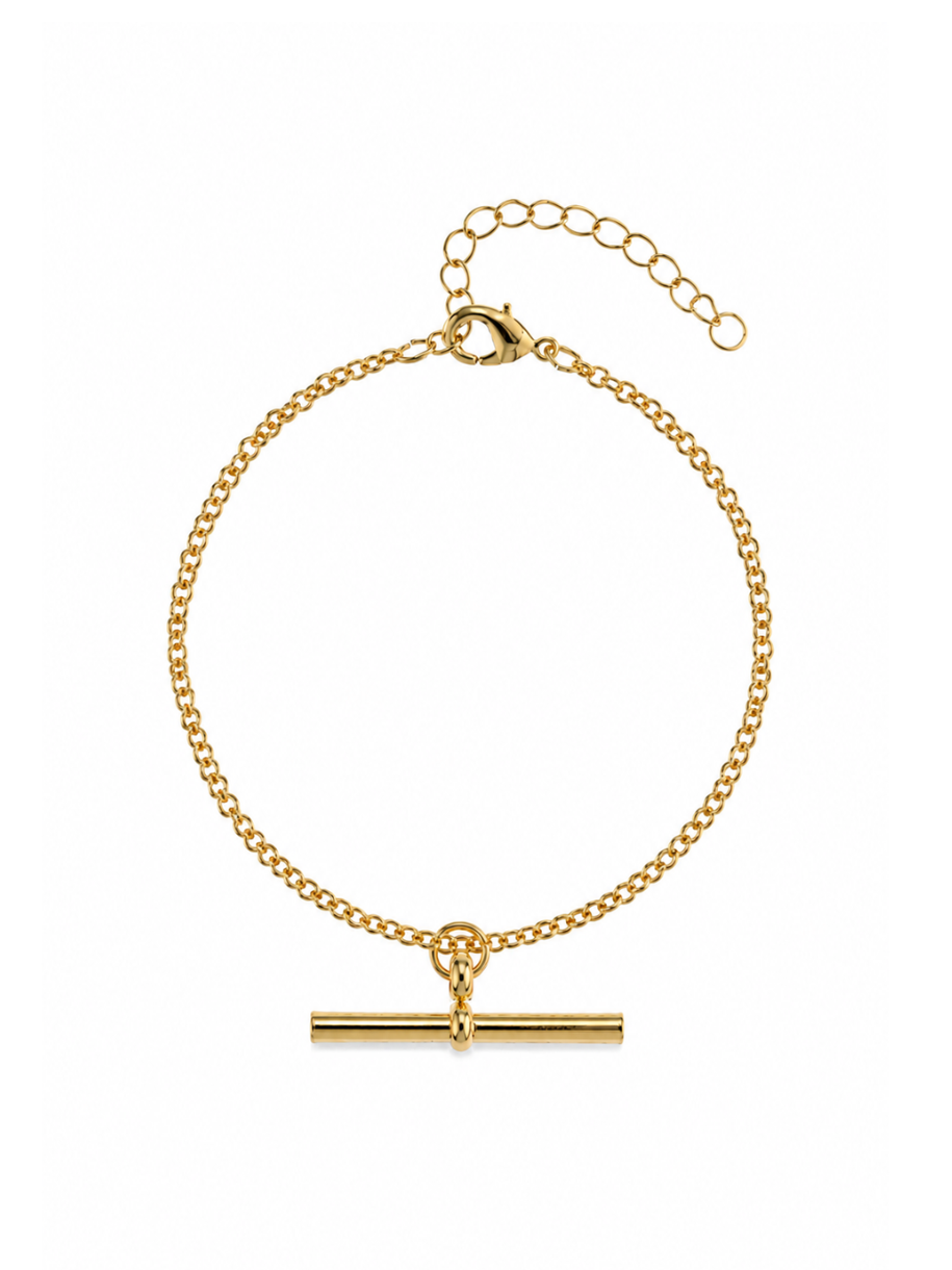 The Curb Link T Bar Bracelet features a classic gold curb chain finished with a horizontal T-bar charm. A lobster clasp and extension chain sit at the opposite end