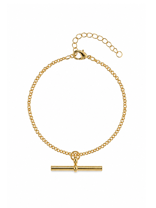 The Curb Link T Bar Bracelet features a classic gold curb chain finished with a horizontal T-bar charm. A lobster clasp and extension chain sit at the opposite end
