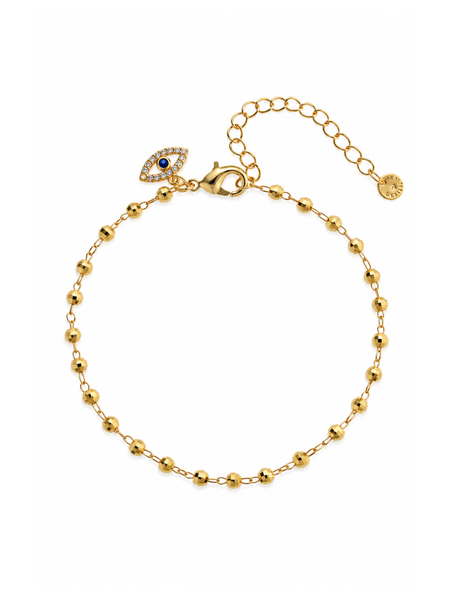 gold beaded chain bracelet with evil eye charm
close up evil eye charm crystal detail gold
chunky gold chain bracelet evil eye pendant
gold protection bracelet evil eye chunky chain