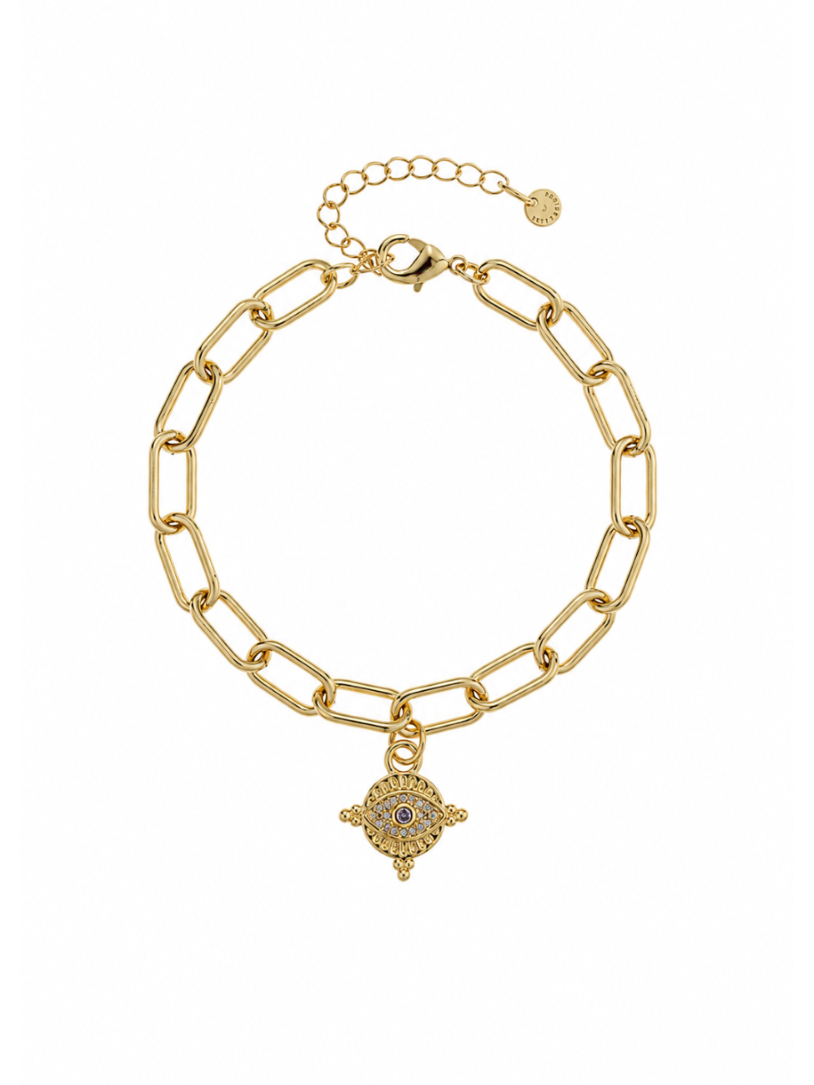 A gold paperclip chain bracelet with a dangling Hamsa hand charm featuring blue and red eye details, displayed on a clean white background.