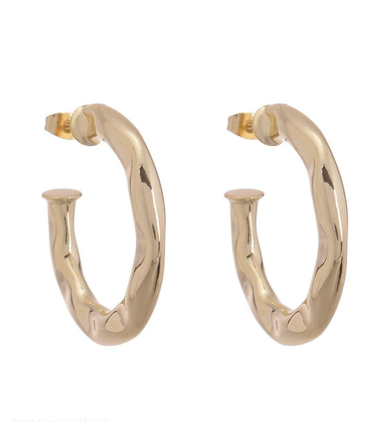 Two gold-colored hoop earrings earrings on a white background.