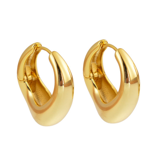 Gold hoop earrings on a white background.