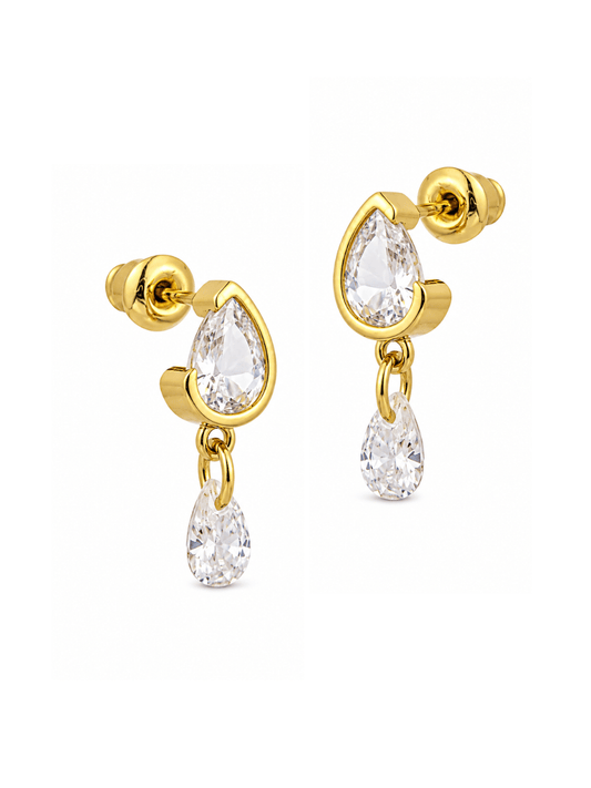 A pair of gold drop earrings with teardrop-shaped clear gemstones, shown on a plain white background.