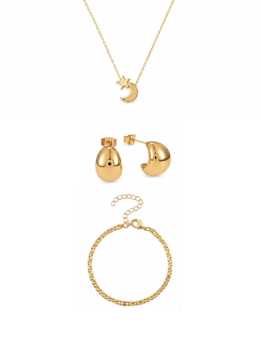 A gold jewelry set featuring a delicate chain necklace with a crescent moon and star pendant, a pair of matching gold dome stud earrings, and a gold chain bracelet, all arranged on a clean white background.