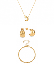 A gold jewelry set featuring a delicate chain necklace with a crescent moon and star pendant, a pair of matching gold dome stud earrings, and a gold chain bracelet, all arranged on a clean white background.
