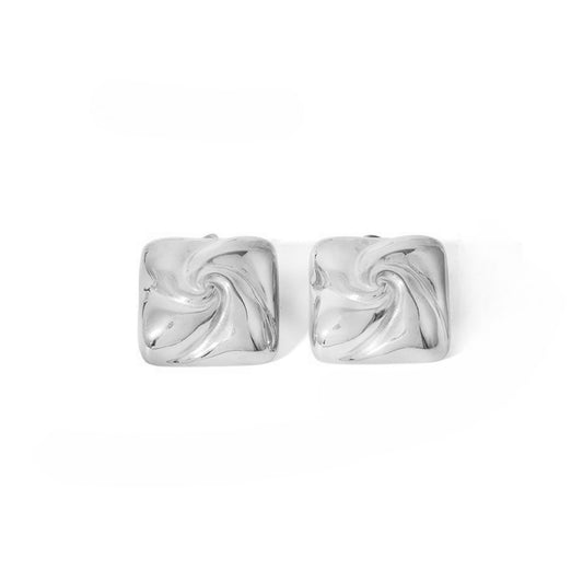 Two silver square earrings earrings with a swirl design.