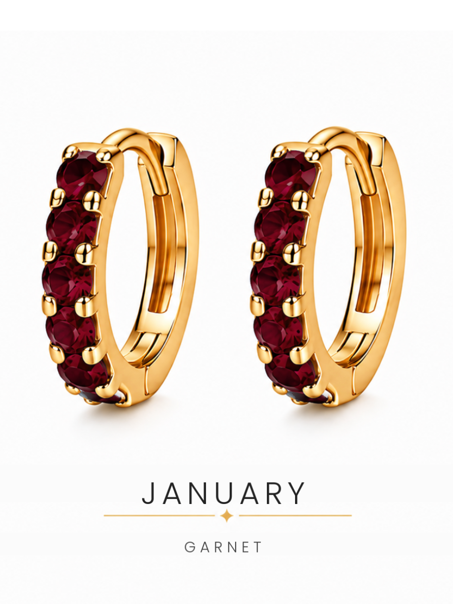 January birthstone gold huggie earrings featuring deep red garnet gemstones, birthstone jewellery