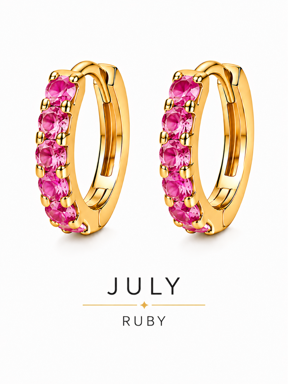 July birthstone gold huggie earrings featuring pink-red ruby gemstones, birthstone jewellery