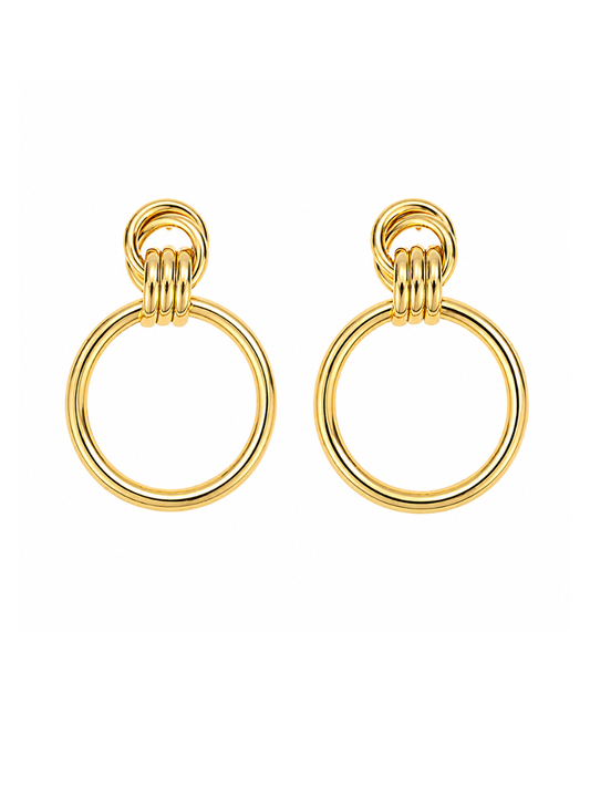 A pair of gold-toned drop earrings with a thick circular ring and a smaller three-loop chain detail at the top, shown on a plain white background.
