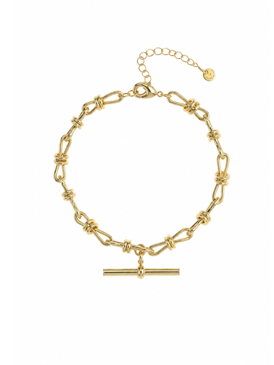 The Knot T Bar Link Bracelet features an oval link chain wrapped with knot detailing at each joint, finished with a horizontal T-bar charm. 