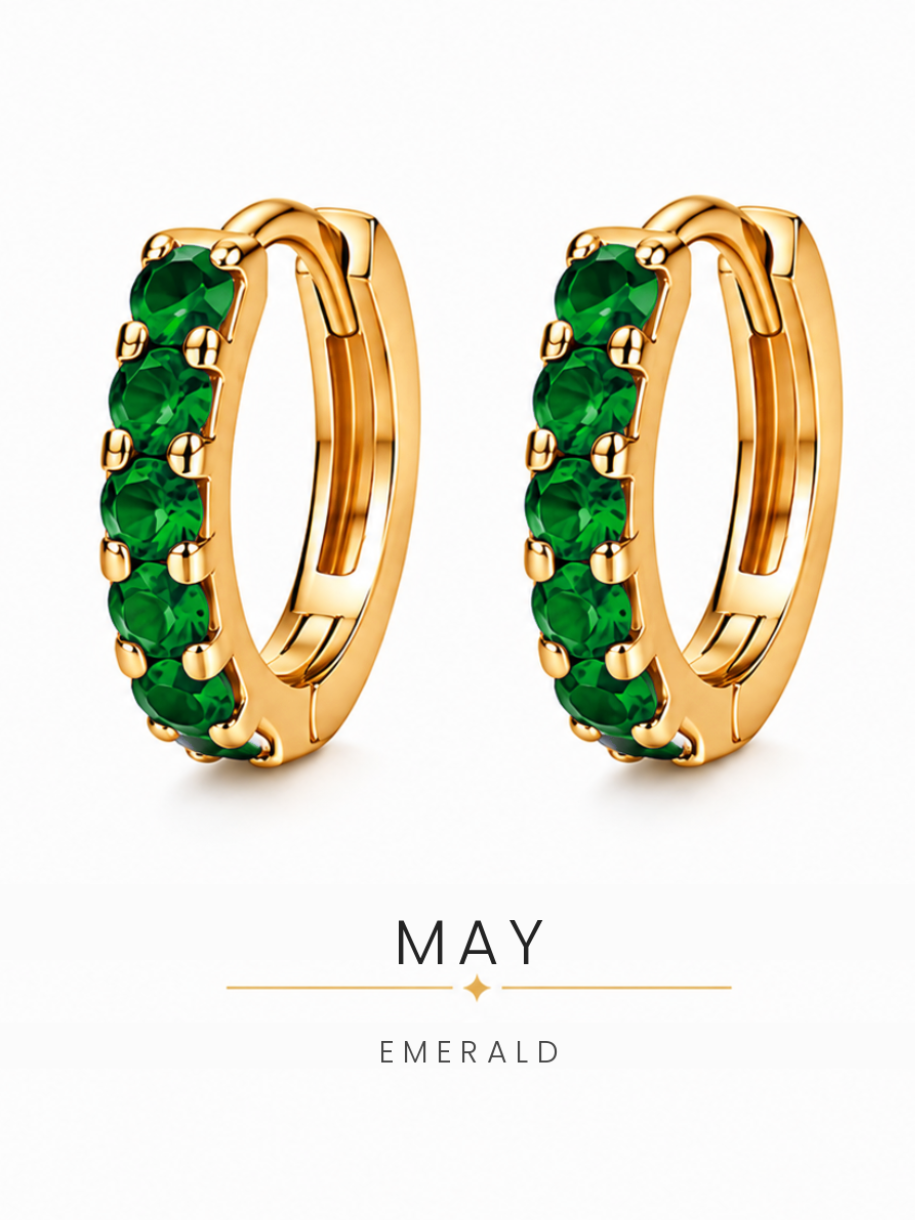 May birthstone gold huggie earrings featuring green emerald gemstones, birthstone jewellery