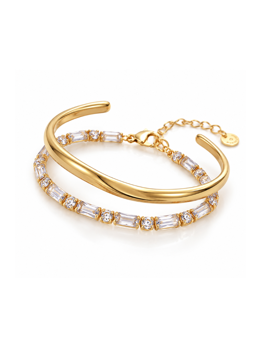 The Elevated Everyday Set featuring a polished gold cuff and sparkling crystal bracelet on a white background.