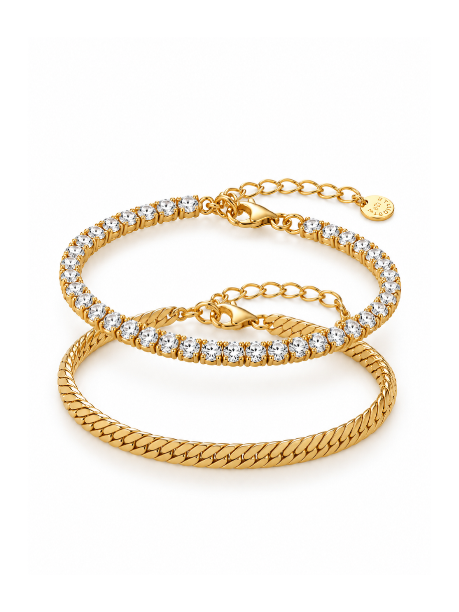 Two gold bracelets stacked on a white background. The top bracelet is a thin chain with clear stones, and the bottom bracelet is a thicker braided chain.