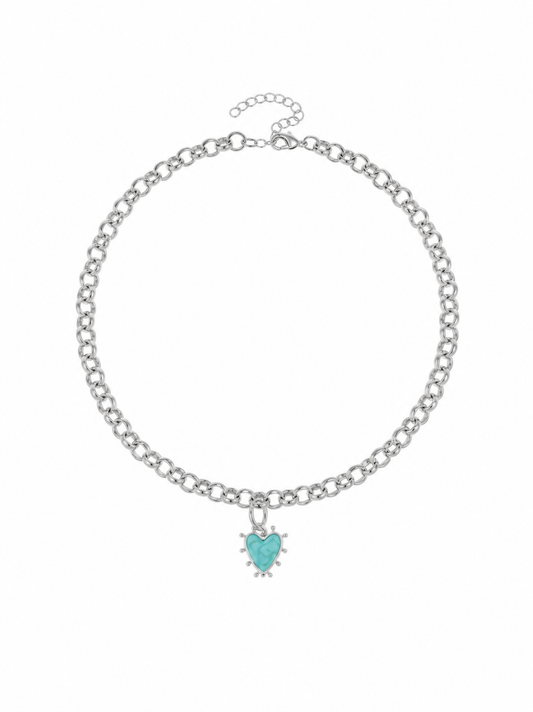 A silver-tone chain necklace with a small heart-shaped turquoise pendant, displayed on a clean white background.
