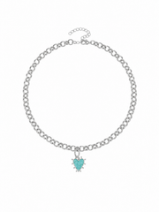 A silver-tone chain necklace with a small heart-shaped turquoise pendant, displayed on a clean white background.