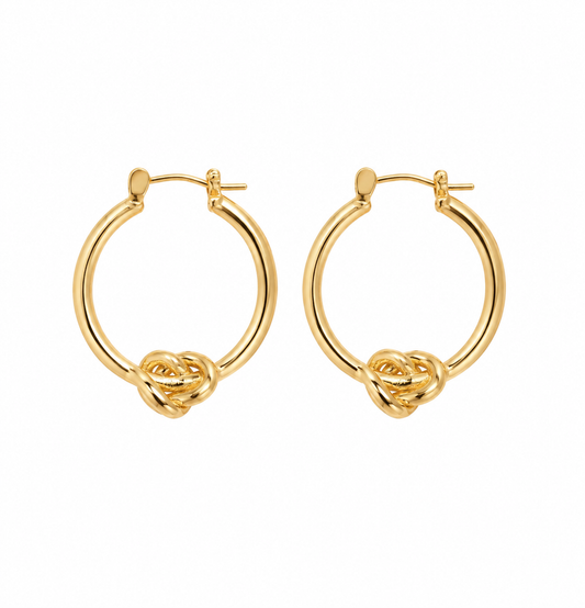 A pair of gold hoop earrings with a knotted detail at the bottom, shown on a plain white background.
