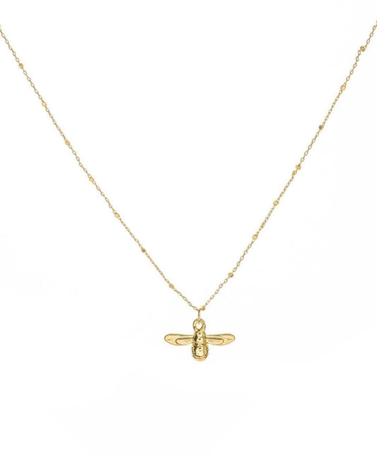 gold bee charm on a necklace 