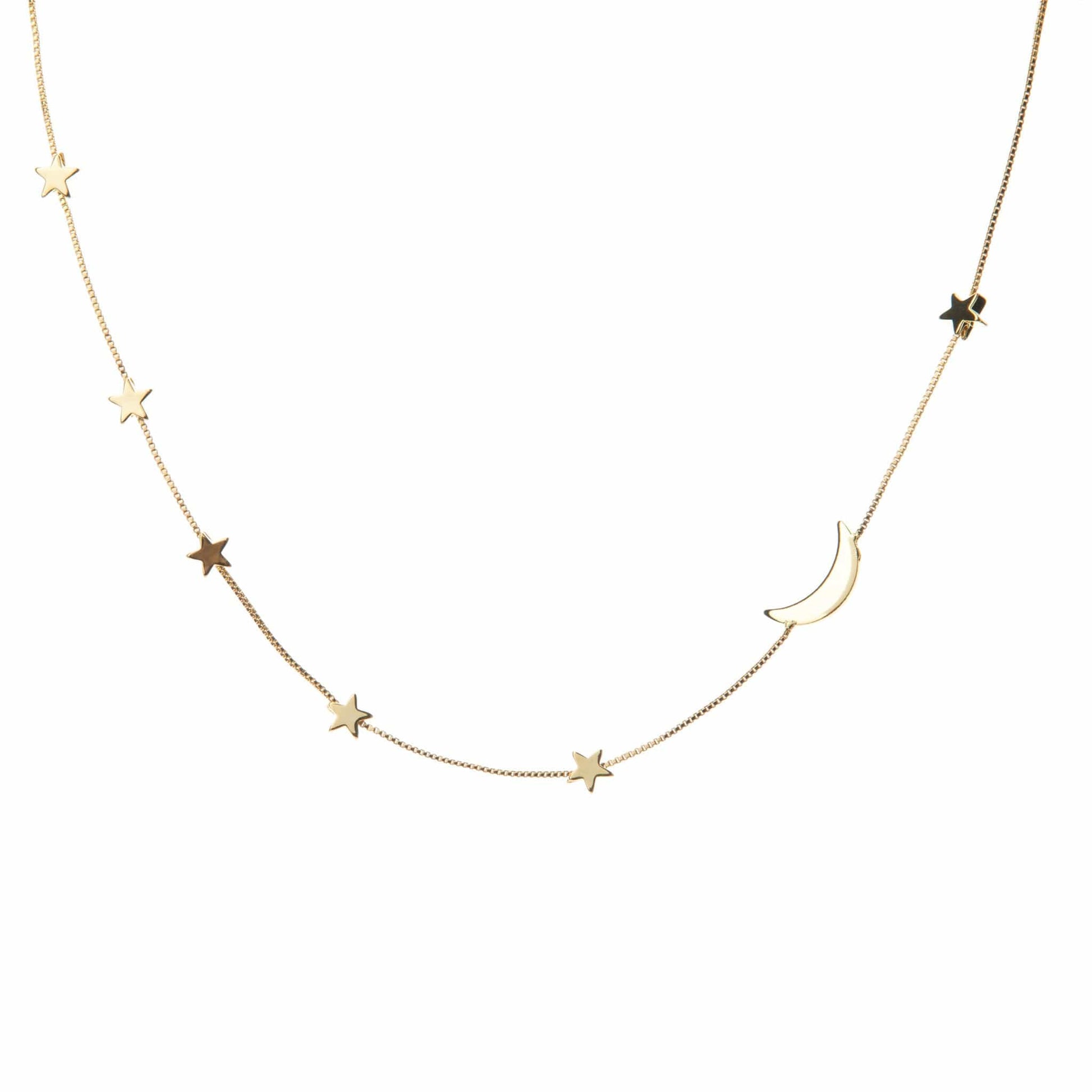Star and moon layering necklace on a gold box chain